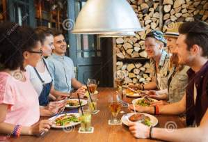 happy-friends-eating-drinking-bar-pub-people-leisure-friendship-communication-concept-group-smiling-talking-56184660