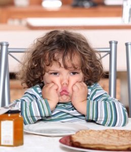 kids-pouting-at-table